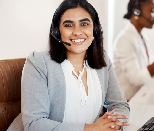 shes-quick-efficient-about-service-she-delivers-portrait-young-call-centre-agent-working-office-with-her-colleague-background 1